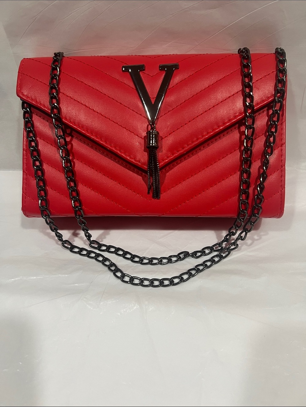 Red Quilted Shoulder Bag with Black Chain Strap and Tassel V Accent